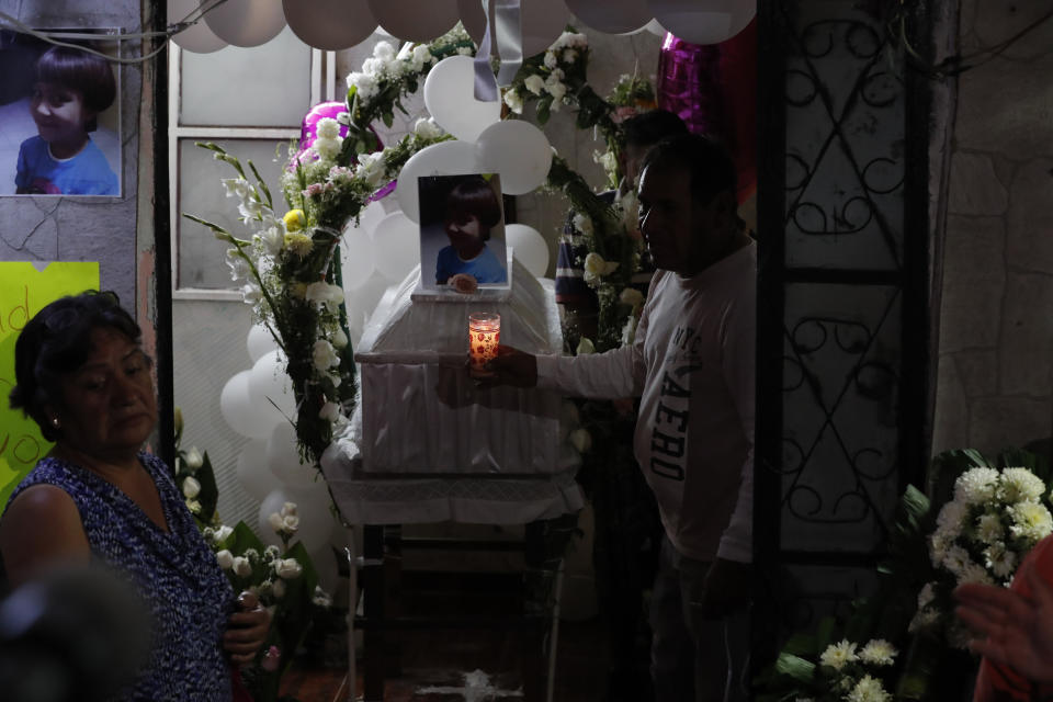The casket with the body of Fatima, a 7-year-old girl who was abducted from the entrance of the Enrique C. Rebsamen primary school and later killed, arrives for her wake at her home in Mexico City, Monday, Feb. 17, 2020. The girl's body was found wrapped in a bag and abandoned in a rural area on Saturday and was identified by genetic testing. (AP Photo/Marco Ugarte)