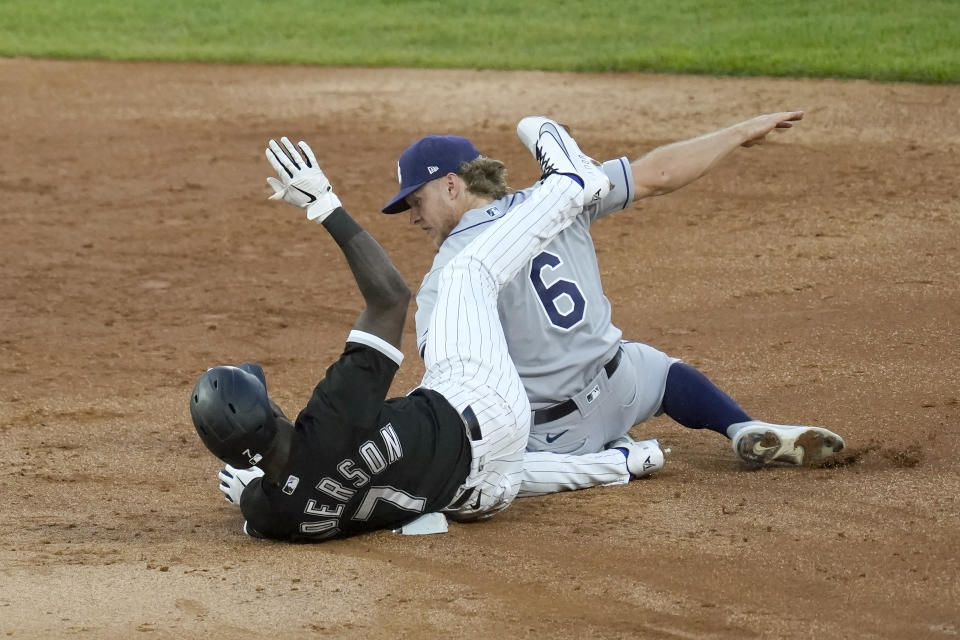 Chicago White Sox's Tim Anderson (7) is safe at second on his double as Tampa Bay Rays' Taylor Walls applies a tag during the third inning of a baseball game Monday, June 14, 2021, in Chicago. (AP Photo/Charles Rex Arbogast)