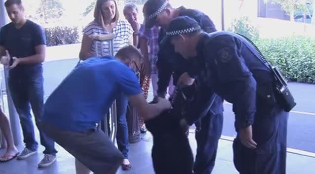 The emotional scene at Senior Constable Luke Warburton walked out of hospital on crutches today. Photo: 7 News