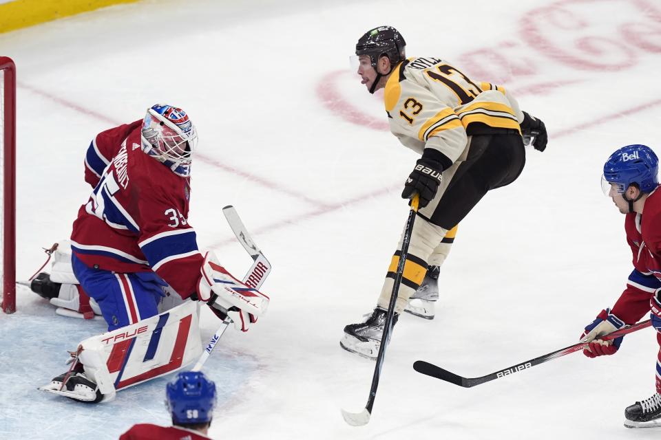 Boston Bruins' Charlie Coyle (13) skates past Montreal Canadiens' Sam Montembeault (35) after scoring during the second period of an NHL hockey game Saturday, Jan 20, 2024, in Boston. (AP Photo/Michael Dwyer)