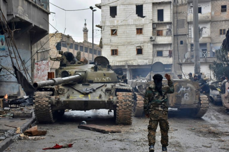 Syrian government forces patrol the northern city of Aleppo