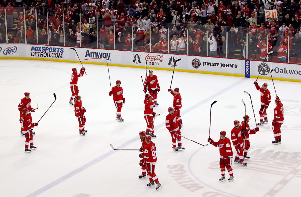 DETROIT, MI - FEBRUARY 14: The Detroit Red Wings salute their fans after their NHL record breaking 21st consecutive home victory by beating the Dallas Stars 3-1 at Joe Louis Arena on February 14, 2012 in Detroit, Michigan. (Photo by Gregory Shamus/Getty Images)