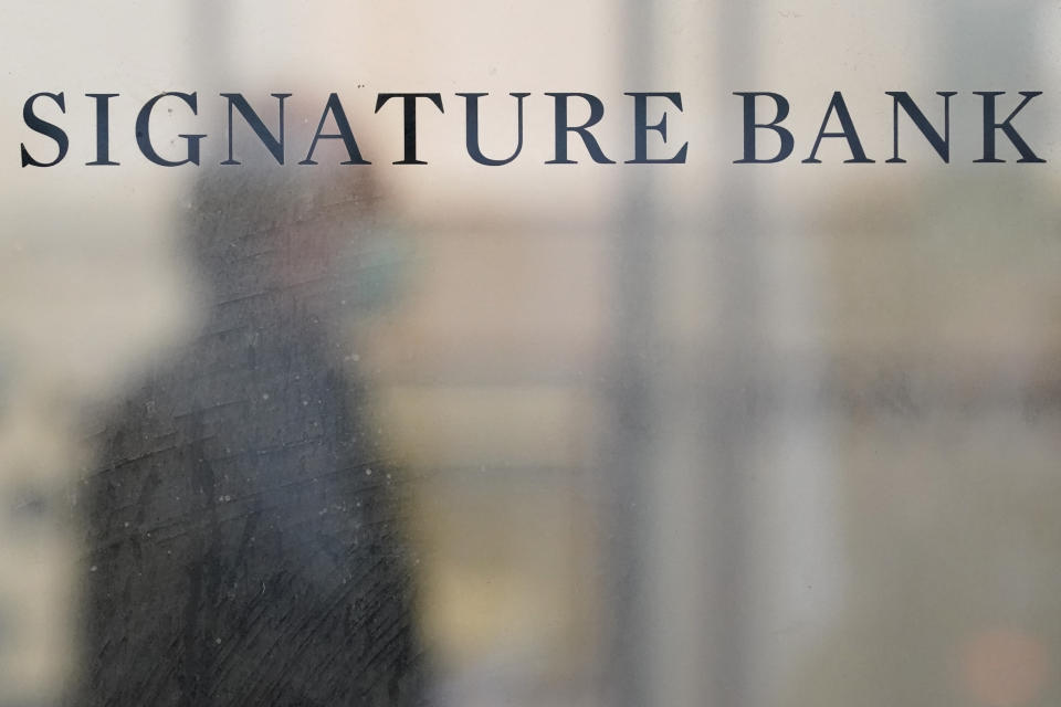 File - A sign is displayed at a branch of Signature Bank in New York, Monday, March 13, 2023. Signature Bank was taken over by regulators in March. (AP Photo/Seth Wenig, File)