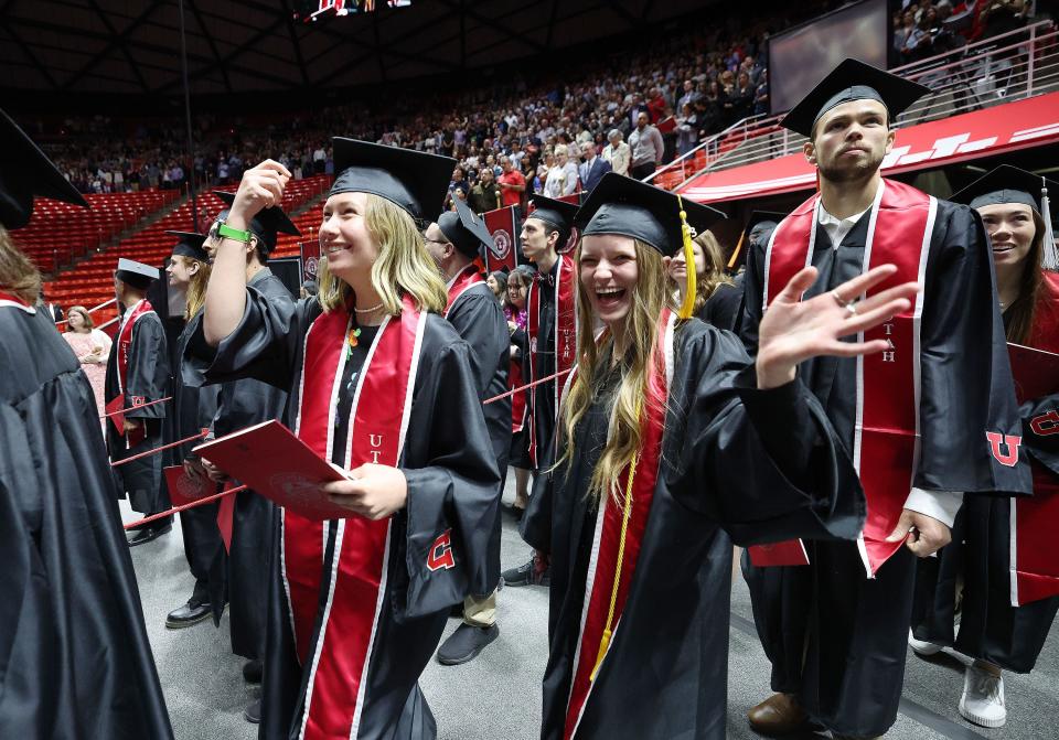 Students celebrate as they walk into the University of Utah’s commencement in Salt Lake City on Thursday, May 4, 2023. With 8,723 graduates, it is the largest group of graduates in the school’s history. | Jeffrey D. Allred, Deseret News