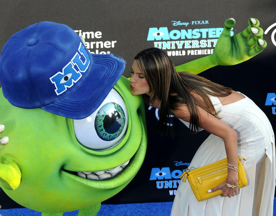 Alessandra Ambrosio kisses monster 'Mike Wazowski' at a Hollywood premiere