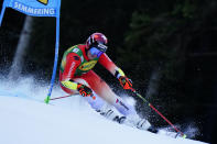 Switzerland's Corinne Suter speeds down the course during an alpine ski, women's World Cup giant slalom, in Semmering, Austria, Tuesday, Dec. 27, 2022. (AP Photo/Piermarco Tacca)