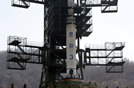 North Korean technicians check the Unha-3 rocket at Tangachai-ri space center. North Korea is hardly known for offering a warm welcome to the world's press, and never before has it given access to a sensitive site featuring its latest space hardware