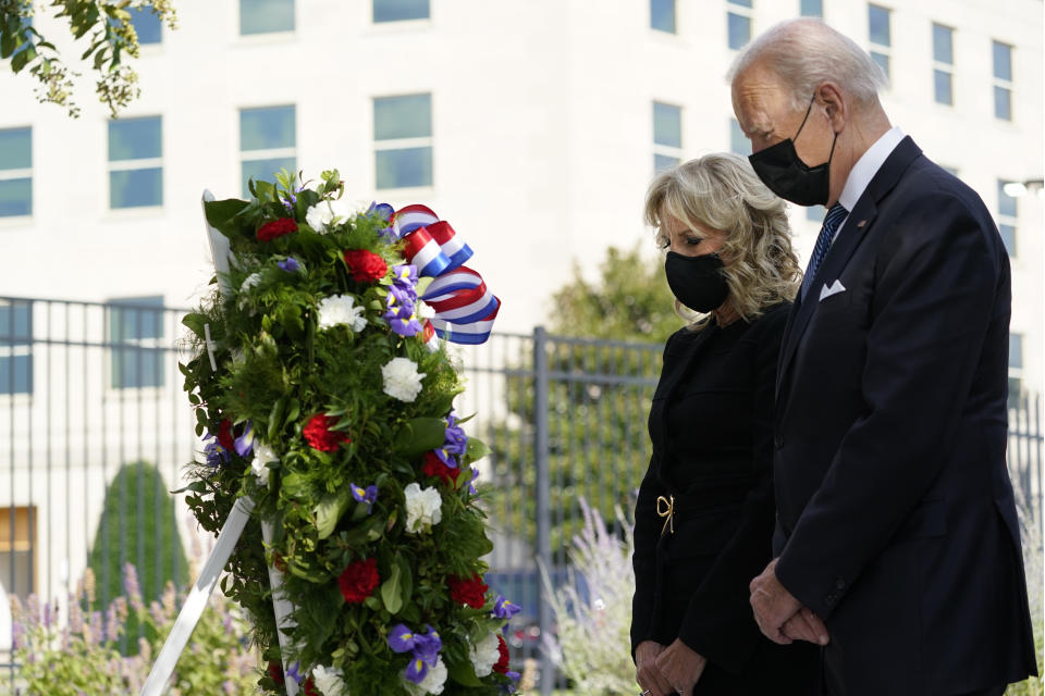 President Joe Biden and first lady Jill Biden participate in a wreath ceremony on the 20th anniversary of the terrorist attacks at the Pentagon in Washington, Saturday, Sept. 11, 2021. (Alex Brandon/AP)