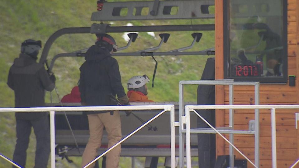 Skiers at the base of Whistler Blackcomb resort wait for a lift to reach snowier elevations on Saturday.