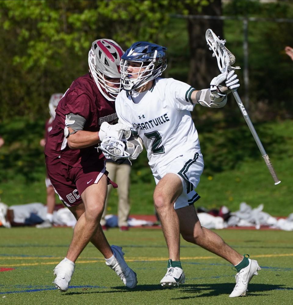Pleasantville's Nick Reich (2) in action during boys lacrosse action against Garden City at Pleasantville High School. Wednesday, April 24, 2024.