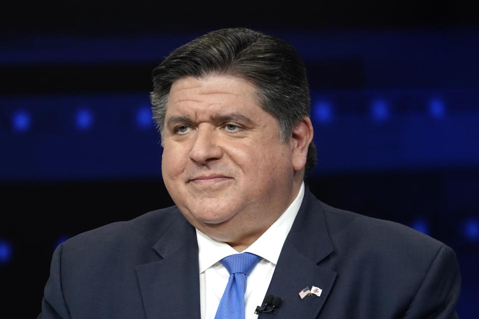 FILE - Illinois Gov. JB Pritzker participates in a debate with Republican gubernatorial challenger, state Sen. Darren Bailey, at the WGN9 studios, Oct. 18, 2022, in Chicago. Pritzker signed into law new U.S. House maps that resulted in Democrats widening their advantage in the 2022 elections to a 14-3 seat majority over Republicans. Illinois’ congressional districts had the largest partisan advantage among states, according to a new 2023 Associated Press analysis. (AP Photo/Charles Rex Arbogast, File)