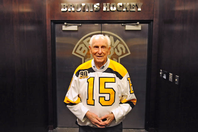 BOSTON, MA - OCTOBER 14: Alumni legend Milt Schmidt of the Boston Bruins poses in front of in front of the locker room prior to the game against the Detroit Red Wings at the TD Garden on October 14, 2013 in Boston, Massachusetts. (Photo by Steve Babineau/NHLI via Getty Images)