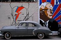 <p>A David Bowie mural, left, is seen alongside one of Bernie Sanders in Los Angeles, April 7, 2016. (Richard Vogel/AP) </p>