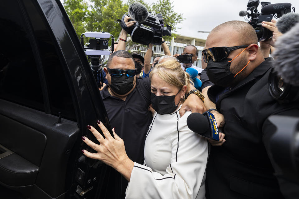 Puerto Rico's former Gov. Wanda Vazquez leaves a court after she was released on bail, in San Juan, Puerto Rico, Thursday, Aug. 4, 2022. Vazquez, who was arrested Thursday, is accused of engaging in a bribery scheme from Dec. 2019 through June 2020, while she was governor, with several people including a Venezuelan-Italian bank owner, a former FBI agent, a bank president and a political consultant. (AP Photo/Alejandro Granadillo)