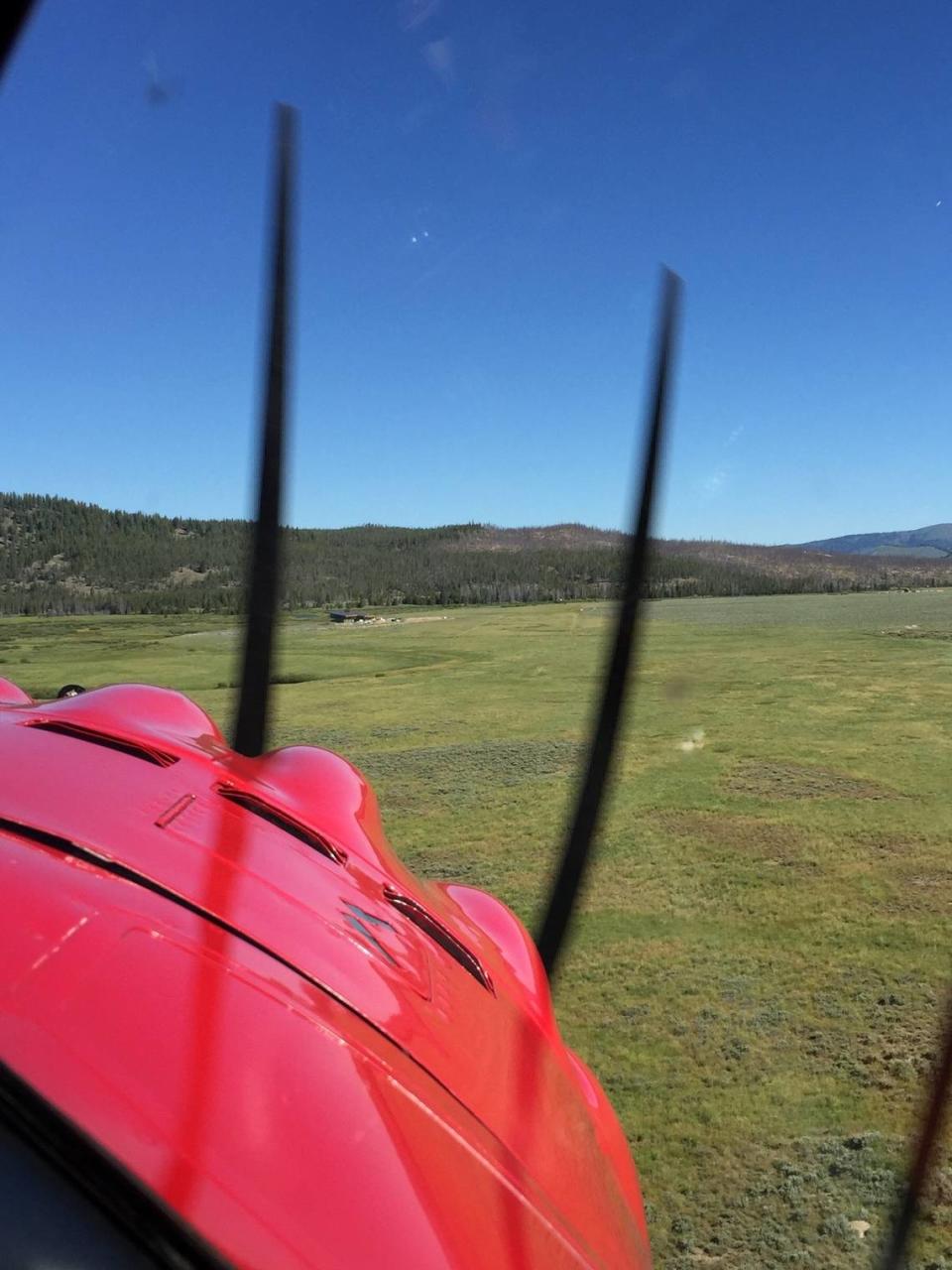 A plane lands in the grass pasture at Hell Roaring Ranch that Michael Boren uses as an airstrip. Boren has applied for a permit to designate the pasture as an official airstrip. He said that would allow it to be used by emergency services like search and rescue.