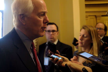 FILE PHOTO: U.S. Senate Majority Whip John Cornyn (R-TX) speaks with reporters after delivering remarks on the Senate floor about the involvement of the United States in Saudi Arabian hostilities inside Yemen, in Washington, U.S., March 19, 2018. REUTERS/James Lawler Duggan