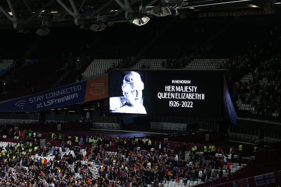 The LED board shows a photo Queen Elizabeth II after it was announced that she died Thursday. It was shown during an UEFA match between West Ham United and FCSB at London Stadium. / Credit: Steve Bardens - UEFA/UEFA via Getty Images