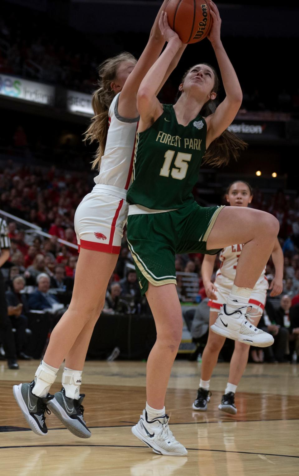 Forest Park's Amber Tretter (15) scores a layup as Frankton's Emma Sperry (10) guards during the IHSAA girls basketball Class 2A state championship at Gainbridge Fieldhouse in Indianapolis, Ind., Saturday afternoon, Feb. 26, 2022