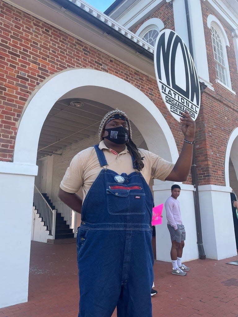 Activists gather at the Market House in downtown Fayetteville on Friday evening to protest the U.S. Supreme Court overturning the Roe v. Wade that protected abortion rights nationwide for nearly five decades.