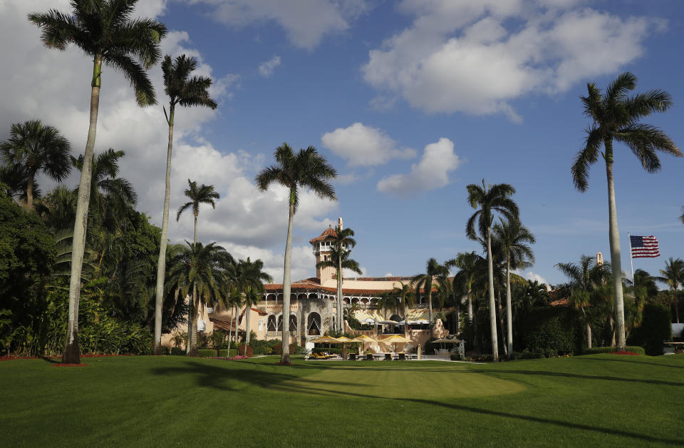 FILE - Mar-A Lago is seen from the media van window, in Palm Beach, Fla., on Nov. 27, 2016. (AP Photo/Carolyn Kaster, File)