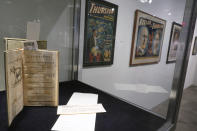 Books and posters from the Ricky Jay Collection are displayed at Sotheby's on Friday, Oct. 22, 2021, in New York. The widow of the sleight-of-hand artist, card shark, author, actor and scholar turned over nearly 2,000 curiosities Jay collected to Sotheby's for an unusual auction. Divided into 634 lots, it's the focus of a live auction Wednesday and Thursday. (Photo by Charles Sykes/Invision/AP)