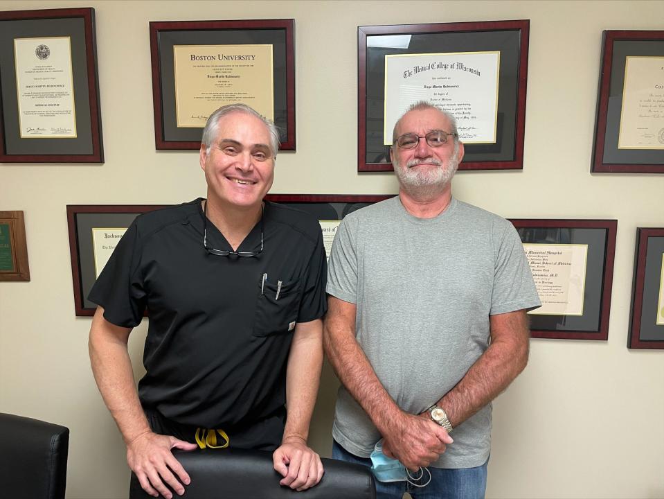 Loxahatchee urologist Dr. Diego Rubinowicz with patient Michael Anthes, 70, of Royal Palm Beach. Rubinowicz has been treating Anthes for "low-grade" bladder cancer since 2015.