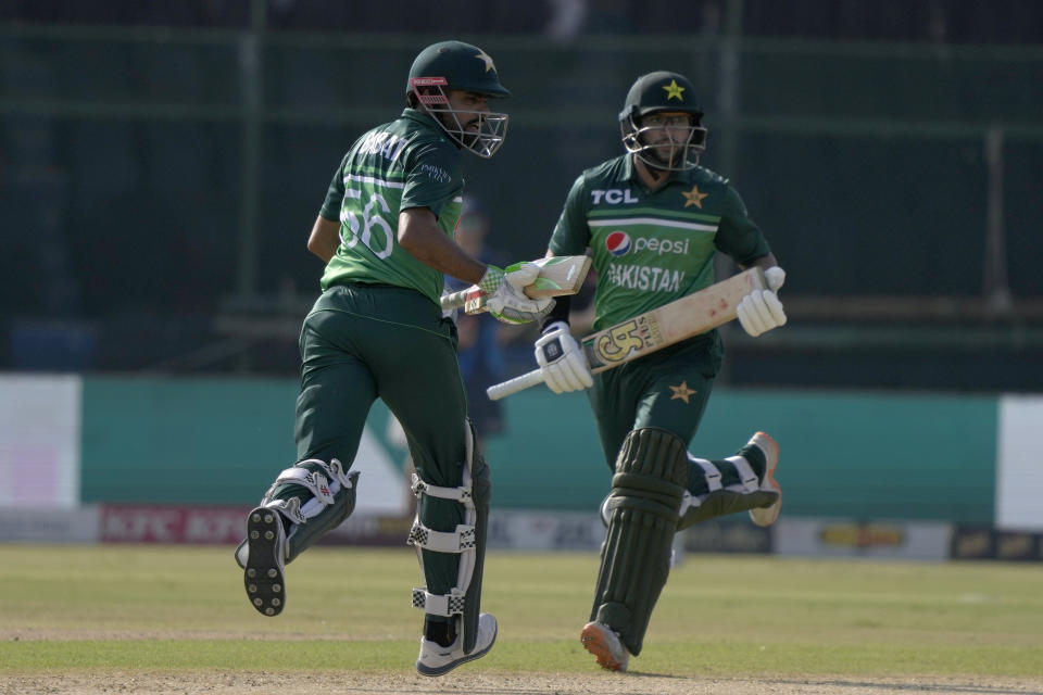 Pakistan's Babar Azam, left, and Imam-ul-Haq take a run during the third one-day international cricket match between Pakistan and New Zealand, in Karachi, Pakistan, Wednesday, May 3, 2023. (AP Photo/Fareed Khan)