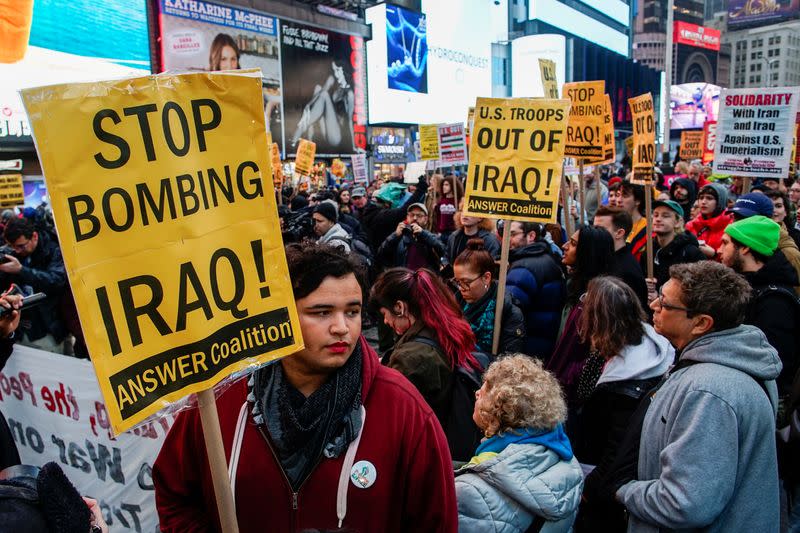 People take part in an anti-war protest amid increased tensions between the United States and Iran at Times Square in New York