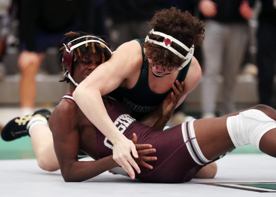 Joe Tornambe from Yorktown and Kayvon Ray from Ossining wrestle in the 145-pound weight class during the Section 1 Division I Dual Meet Tournament at Yorktown High School Dec. 21, 2023. Tornambe won the match.