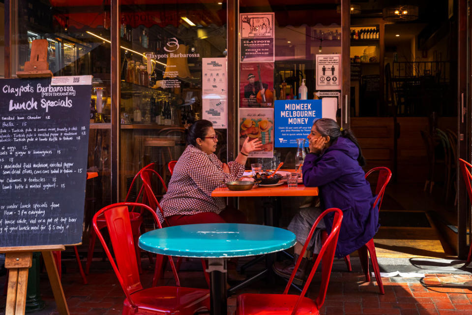 People are seen dining along Hardware Lane in Melbourne, Australia during the Covid pandemic.