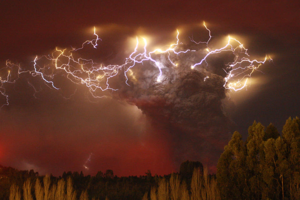 There are at least two types of volcanic lightning, a new radio-mapping study found. One occurs at the mouth of the volcano, and the other—as shown over Chile's Puyehue-Cordón Caulle volcano complex in 2011—electrifies the heights of the plume, possibly as rising water becomes a mix of droplets and ice-coated ash particles. Photograph by Carlos Gutierrez, Reuters <br><br><a href="http://news.nationalgeographic.com/2012/06/pictures/120611-volcano-lightning-volcanic-redoubt-eos-science/" rel="nofollow noopener" target="_blank" data-ylk="slk:Click here;elm:context_link;itc:0;sec:content-canvas" class="link ">Click here</a> to see more National Geographic photos.