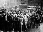 FILE - In this Oct. 9, 1930 file photo, thousands of unemployed people gather outside City Hall in Cleveland during the Great Depression, after some 2,000 jobs were made available for park improvements and repairs. (AP Photo/File)