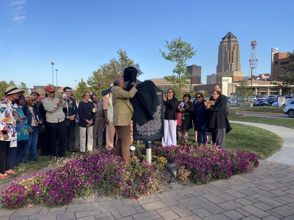 Richard Duncan, a former resident and historian of Center Street, unveils a historical marker commemorating the neighborhood Thursday, Oct. 5, in Des Moines.