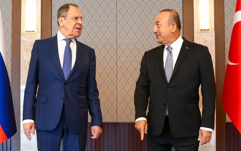 Russia's Foreign Minister Sergey Lavrov, left, and his Turkish counterpart Mevlut Cavusoglu speak during their meeting in Ankara, Turkey, on June 8, 2022. - Russian Foreign Ministry/AP