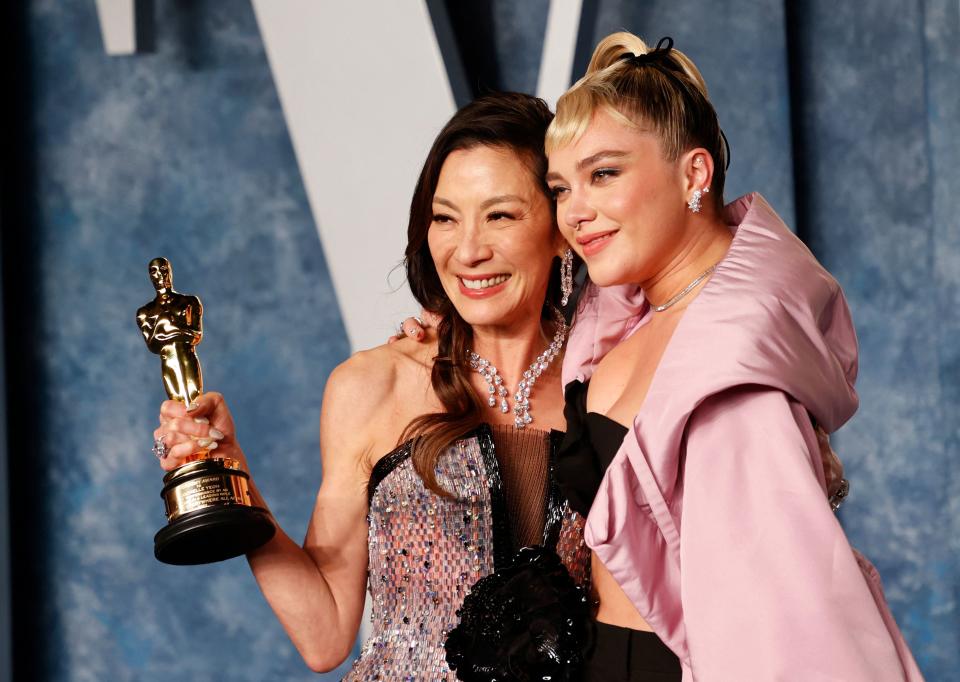 Malaysian actress Michelle Yeoh (L) winner of the Oscar Best Actress in a Leading Role for 