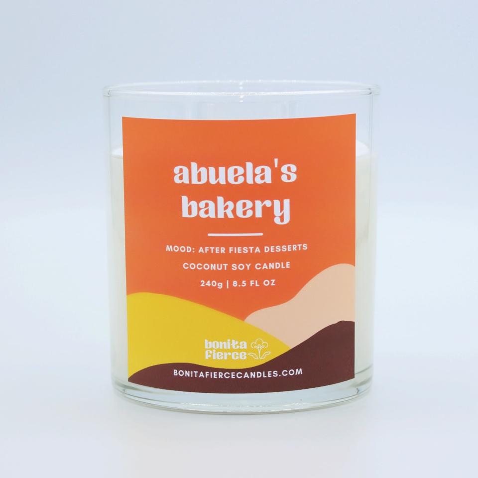 <p><a href="https://bonitafiercecandles.com/collections/signature-scents/products/abuelas-bakery-candle" rel="nofollow noopener" target="_blank" data-ylk="slk:Shop Now;elm:context_link;itc:0;sec:content-canvas" class="link ">Shop Now</a></p><p>Abuela's Bakery Candle</p><p>bonitafiercecandles.com</p><p>$34.00</p><span class="copyright">Bonita Fierce</span>