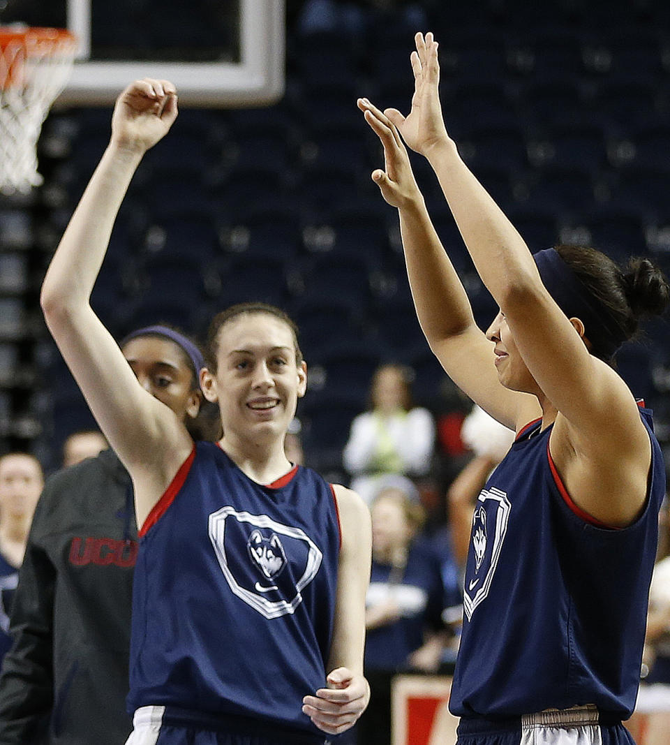 Connecticut forward Breanna Stewart, left, waves to fans during practice before the women's Final Four of the NCAA college basketball tournament, Saturday, April 5, 2014, in Nashville, Tenn. Connecticut plays Stanford Sunday. (AP Photo/Mark Humphrey)