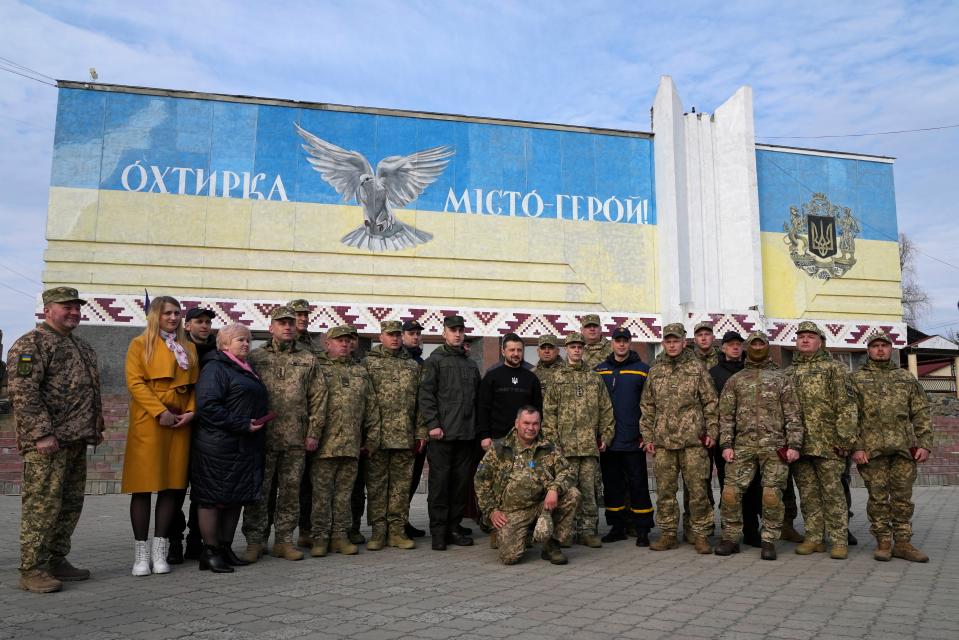 Ukrainian President Volodymyr Zelenskyy poses for a photo with military personnel, police officers and civilians (Copyright 2023 The Associated Press. All rights reserved)