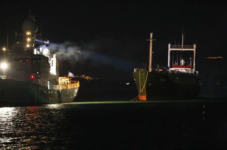 Sierra Leone-flagged vessel Ezadeen (R) arrives at the Corigliano Calabro harbour in southern Italy early January 3, 2015. REUTERS/Antonino Condorelli