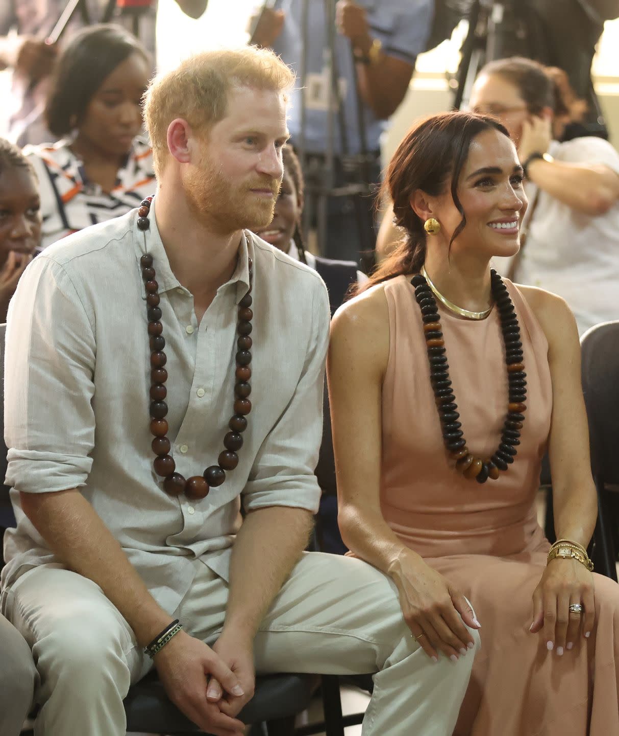 abuja, nigeria may 10 duke of sussex prince harry l his wife meghan markle r, duchess of sussex, visit the lightway academy in abuja, nigeria as part of celebrations of invictus games anniversary on may 10, 2024 photo by emmanuel osodianadolu via getty images