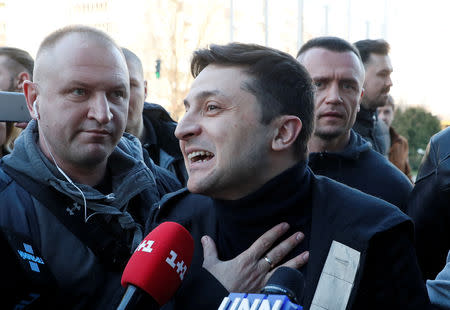 FILE PHOTO: Ukrainian presidential candidate and comedian Volodymyr Zelenskiy speaks with journalists before undergoing a drugs and alcohol test, which is a precondition to participate in a policy debate ahead of the second round of a presidential election, outside a hospital in Kiev, Ukraine April 5, 2019. REUTERS/Valentyn Ogirenko/File Photo