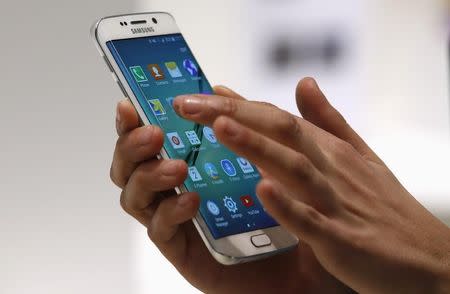 A hostess displays the new Samsung Galaxy S6 Edge smartphone during the Mobile World Congress in Barcelona 