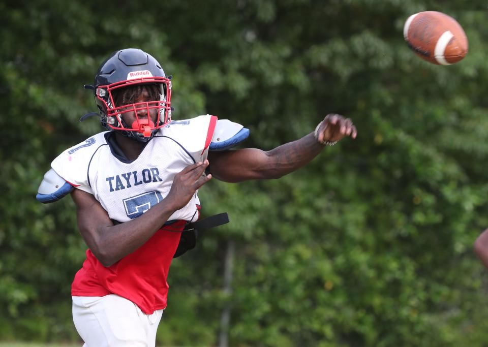 Taylor High's Anthony Miler #7 throws a pass, Tuesday May 9, 2023 during spring practice.