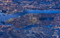 <p>These incredible, mind-bending aerial images offer a completely different way to view the vibrancy of New York City. Shot from above, some of the distorted images make the Big Apple appear like a planet, while others, photographed directly downward, make skyscrapers look like something out of an abstract artwork. (Photo: Andrew Griffiths/Lensaloft/Caters) </p>