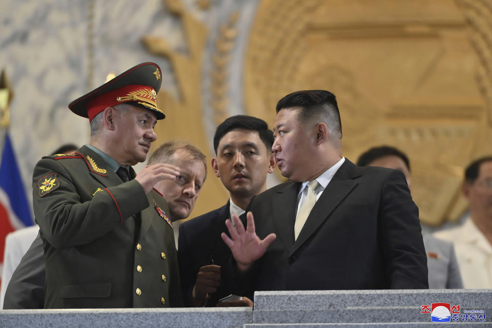 In this photo provided by the North Korean government, North Korean leader Kim Jong Un, front right, talks with Russian Defense Minister Sergei Shoigu, left, during a military parade to mark the 70th anniversary of the armistice that halted fighting in the 1950-53 Korean War, on Kim Il Sung Square in Pyongyang, North Korea Thursday, July 27, 2023. Independent journalists were not given access to cover the event depicted in this image distributed by the North Korean government. The content of this image is as provided and cannot be independently verified. Korean language watermark on image as provided by source reads: "KCNA" which is the abbreviation for Korean Central News Agency. (Korean Central News Agency/Korea News Service via AP)