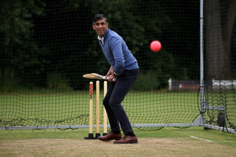 Rishi Sunak bats in the nets during his visit to Nuneaton Cricket Club on Monday (POOL via Georgian public Broadca)