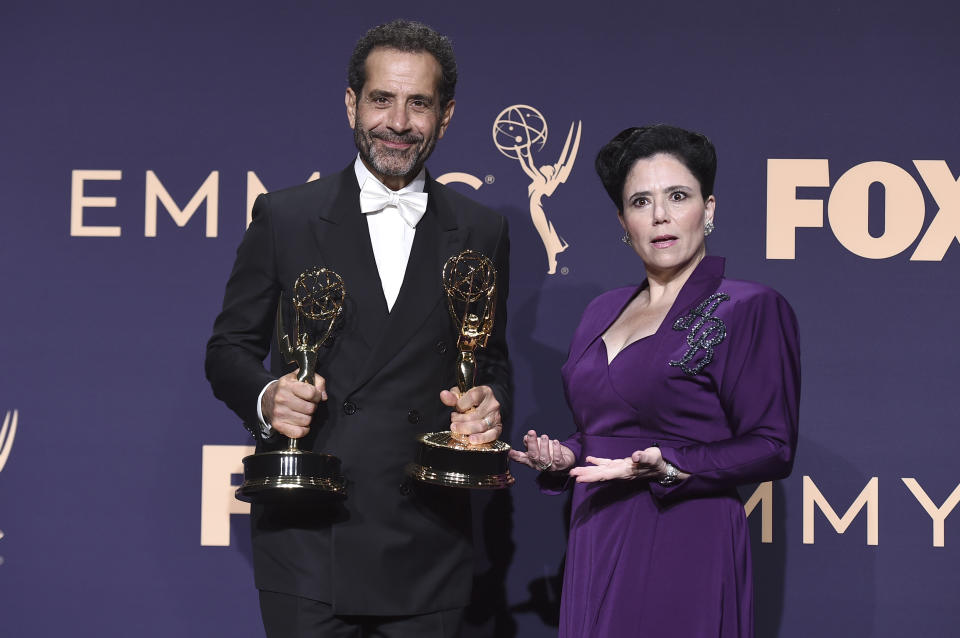 Tony Shaloub, left, poses with the award for outstanding supporting actor in a comedy series, and Alex Borstein, right, poses with the award for outstanding supporting actress in a comedy series for "The Marvelous Mrs. Maisel" in the press room at the 71st Primetime Emmy Awards on Sunday, Sept. 22, 2019, at the Microsoft Theater in Los Angeles. (Photo by Jordan Strauss/Invision/AP)