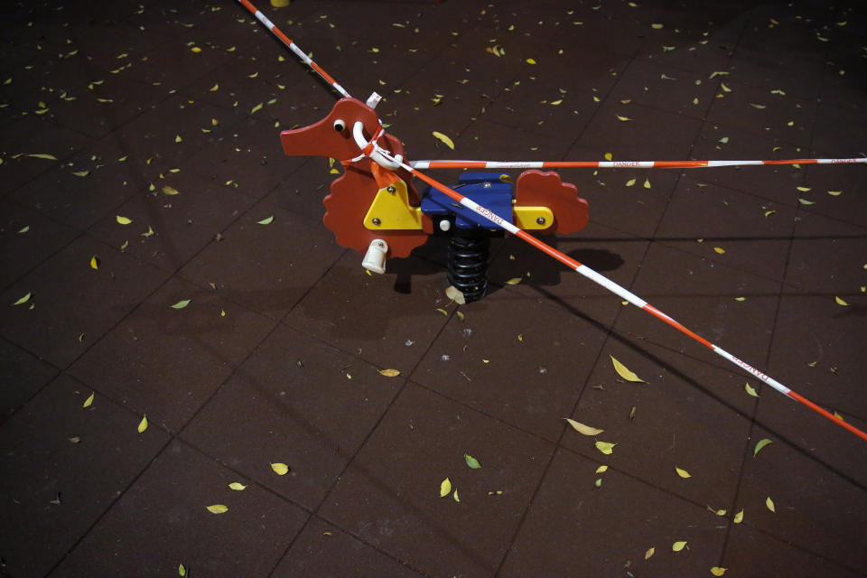 Children's playground toys are closed as a deterrent to help curb the spread of the coronavirus in Hong Kong, March 29, 2020. (AP Photo/Kin Cheung)