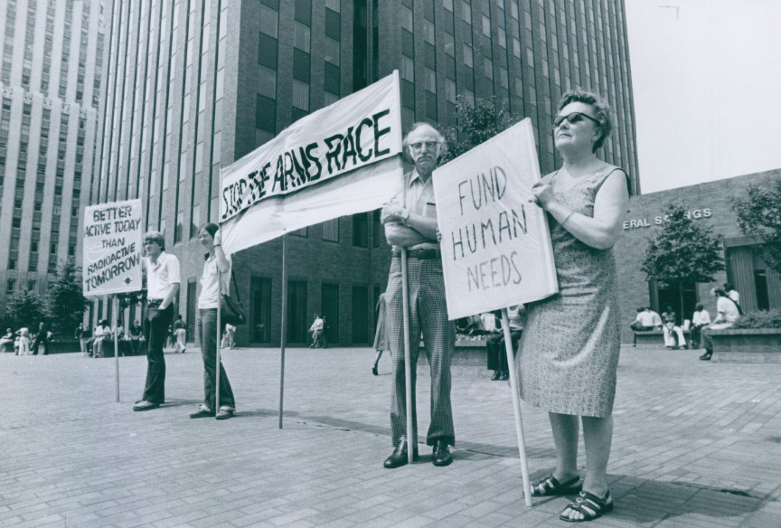 Members of the American Friends Service Committee demonstrate in downtown Akron in 1978 against the nuclear arms race. Pictured from left are Doug Fulmer, Marcia Hartman, Robert J. Baldaug and Mary Woodford.