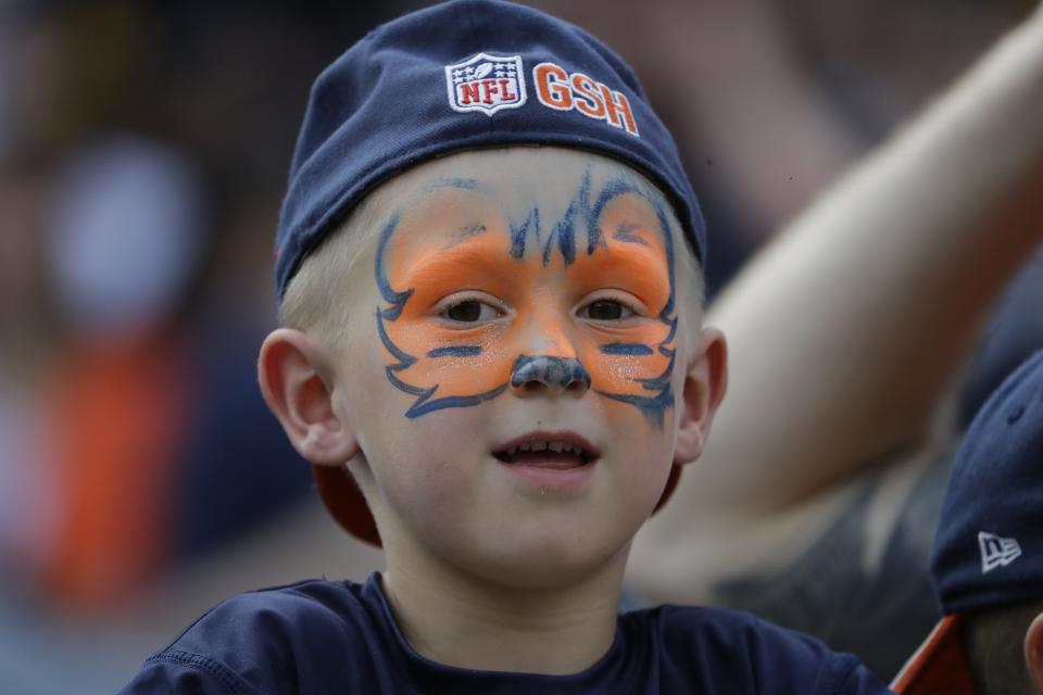 A fan watches during the second half of a preseason NFL football game between the Chicago Bears and the Kansas City Chiefs Saturday, Aug. 25, 2018, in Chicago. (AP Photo/Nam Y. Huh)